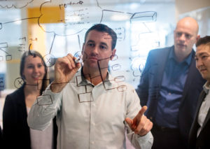 PalAmerican Employees Brainstorming on Invisible Board