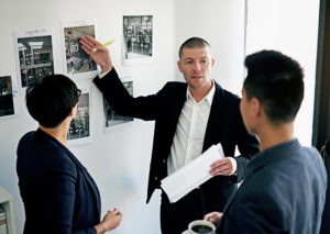 PalAmerican Three Individuals Strategizing
