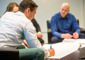 PalAmerican Employees Writing on Blueprints