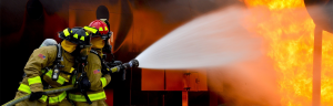 Two Firefighters putting out fire