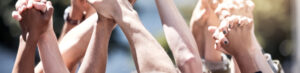 Labour Risk Management - Shot of a group of protestors with their fists raised